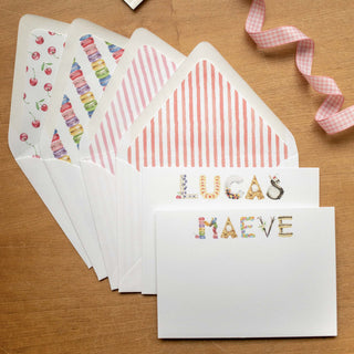 Dessert Personalized Stationery by The Letter Nest in name Maeve and Lucas with various watercolor printed liners in a flatlay styled photo