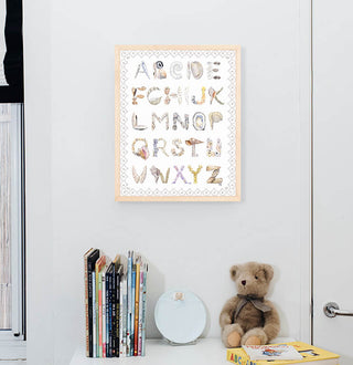 Shell Alphabet with Scallop Border , shown in a Natural Frame installed in nursery