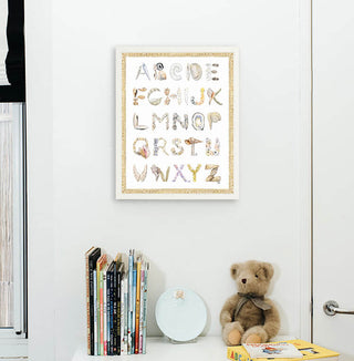 Shell Alphabet with Braided Rope border, shown in a White Frame installed in nursery