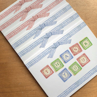"Thank You" foldover cards by The Letter Nest with painted alphabet blocks and gingham ribbon, stacked in a style in red and blue variations