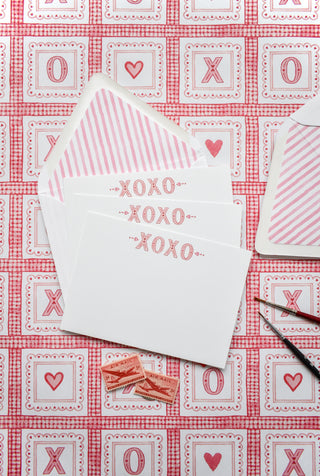 Flatlay photo of Valentine cards by The Letter Nest featuring watercolor "XOXO"